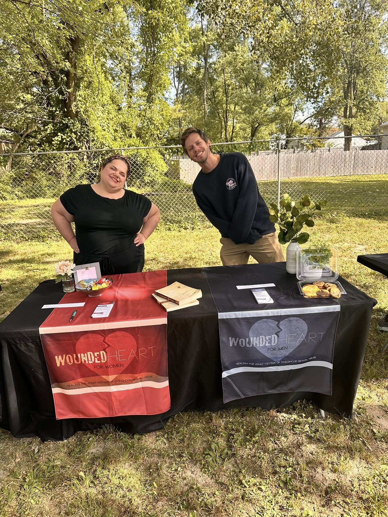 Manasseh Ministries volunteers at a Wounded Heart outreach table